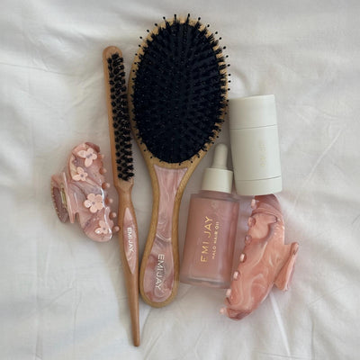 Flat Brush and Styling Brush in Pink Chantilly with assorted hair care and accessories