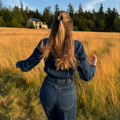 model standing in field with Lil Effing Clip in Blueberry in hair