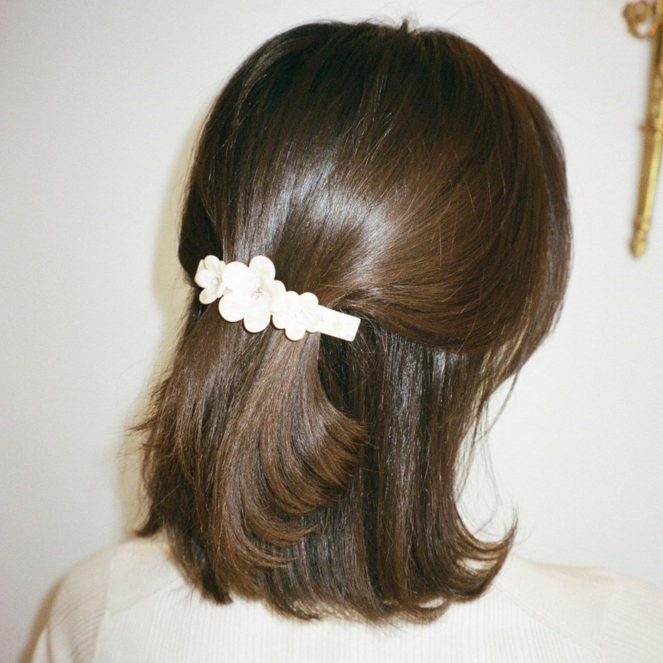 model wearing Ponytail Barrette in Chantilly Bloom in hair