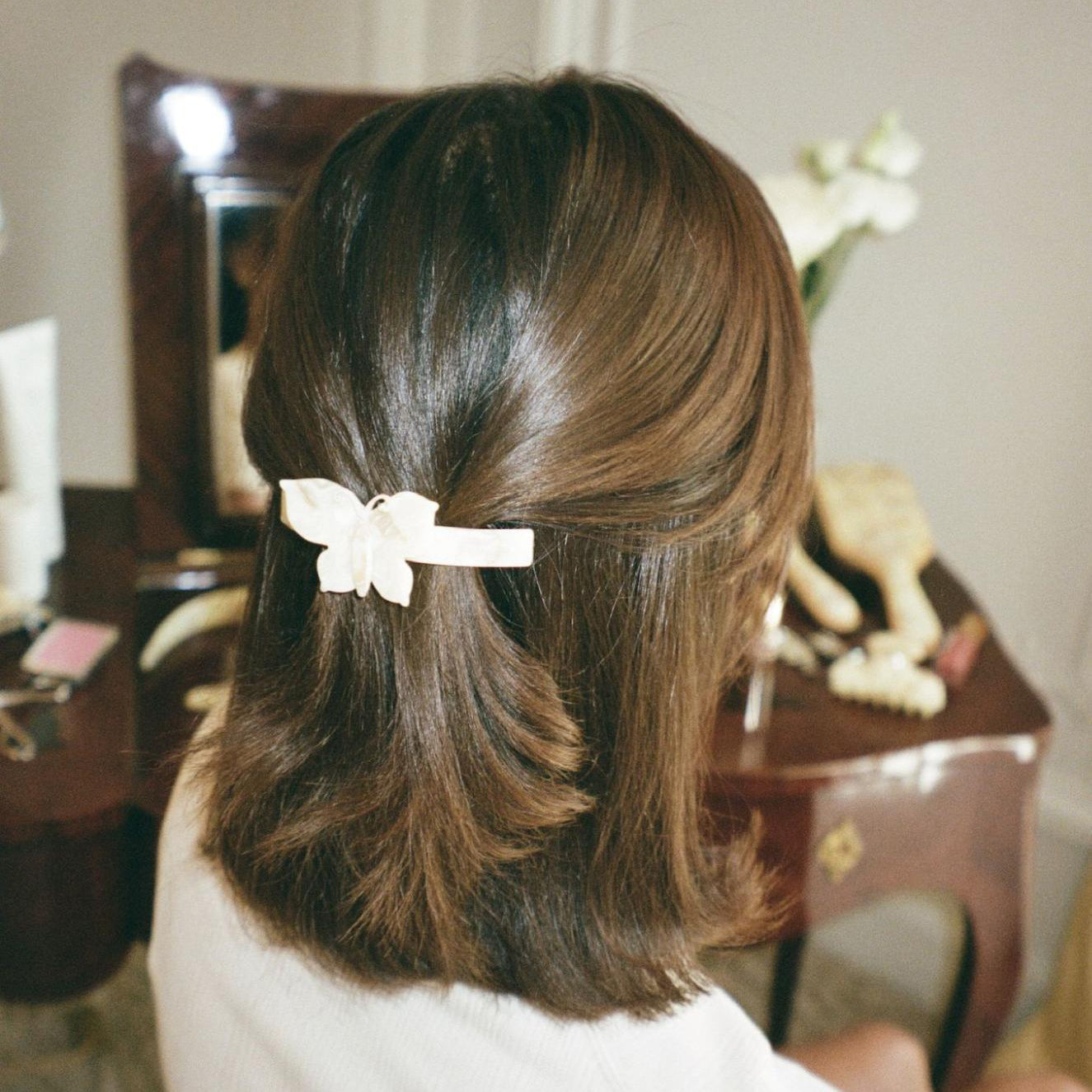 model wearing Ponytail Barrette in Chantilly Papillon in hair