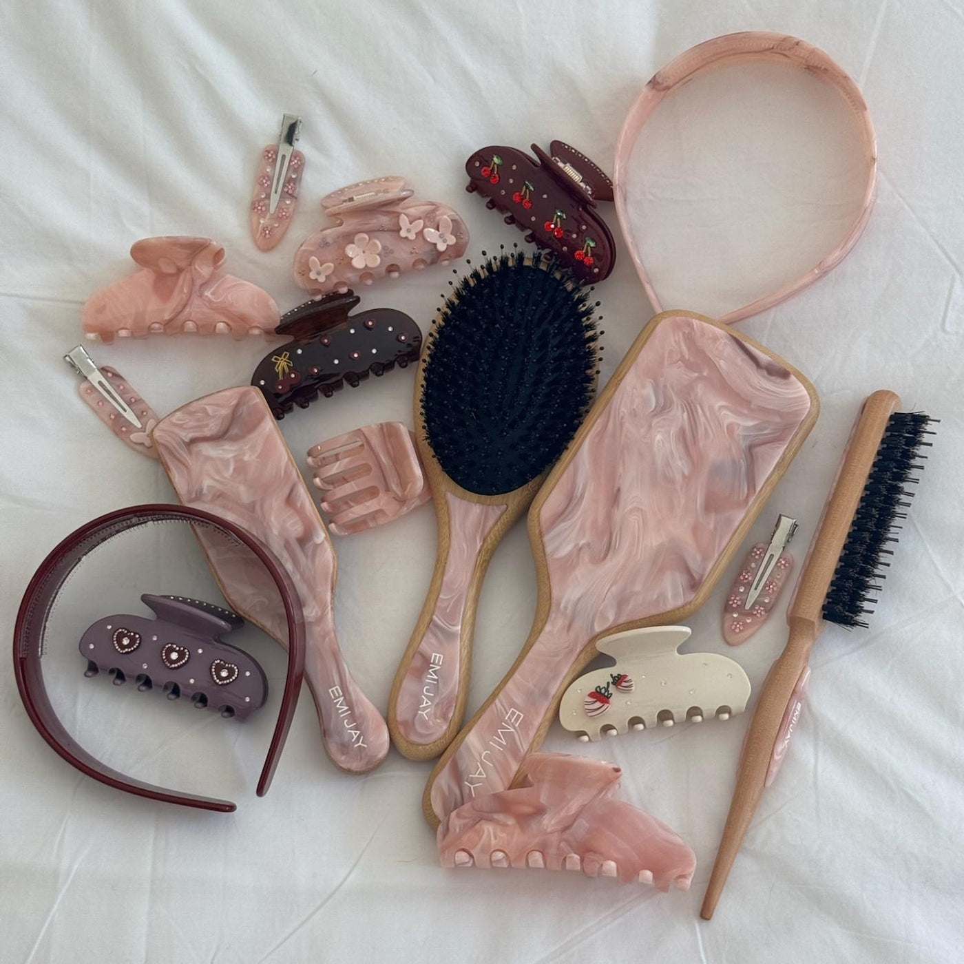 Styling Brush in Pink Chantilly with assorted hair accessories